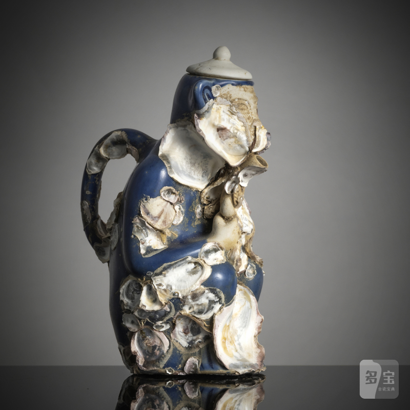 An underglaze-blue porcelain teapot in the shape of a seated monkey
